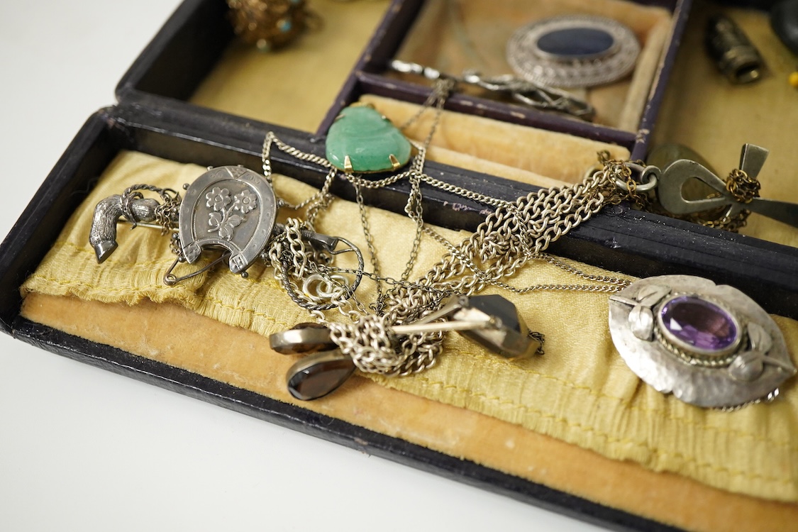 A group of mainly silver and white metal costume jewellery, including a moonstone set brooch, 53mm, a filigree gilt metal and enamel fob and marcasite set bracelet etc.